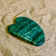 GUA SHA aus hochwertigem Prasem (ca. 9 x 6 cm), energetisiert mit REIKI-Energie; spirituelles Wellness-Tool zur Förderung von geistiger Klarheit, Harmonie, Ausgeglichenheit und spirituellem Wachstum. Jeder GUA SHA ist ein Unikat mit individueller Kristallstruktur und spiritueller Aufladung. Ideal zur energetischen Unterstützung deiner Gesichtspflege-Routine.